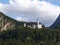 Neuschwanstein Castle in Baviera, Germany, with the forest tree