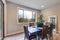 Neutral dining room interior fitted with black dining table