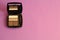 Neutral palette of eye shadows in the case, powder pink background, free copy space