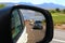 Nevada landscape in car mirror