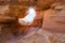 Nevada State Park Valley of Fire. The sun shines through the arch in red sandstone