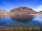 Nevado de Toluca, Mexico. Mirroring of a mountain in the blue waters of a lagoon.