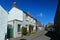 New Abbey High Street with Historic Houses and Ruins of Sweetheart Abbey, Dumfries and Galloway, Scotland, Great Britain