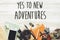 New adventure text sign concept. say yes to new adventures. time