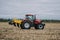 New agricultural machinery, tractors in motion at demonstration field site at agro exhibition AgroExpo. Tractor working on the