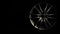 New alloy wheel for car rolls into frame in dark background. Modern metal equipment for auto and vehicle. Luxury design