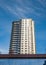 New apartment building on a sunny day with a blue sky. Facade of a modern multistoried new stylish living block of flats