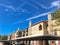 New apartment complex with covered parking under sunny cloud sky in Texas