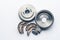 New auto parts brake drums, pads, cylinders on white background