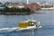 New Bedford, Massachusetts, USA - September 15, 2018: Lobster boat Miss Molly crossing New Bedford inner harbor with stacks of