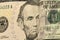 A new bill in five American dollars background