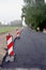 New black asphalt layer on rural gravel road