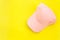 New blank pink baseball hat on yellow background with free space