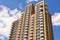 New block of modern apartments with balconies and blue sky