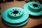 new blue green brake discs prepared for wheel repair
