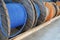 New blue power cable is wound on wooden coil. Background. Cable for laying underground.