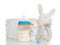 New born child stack of diapers, nipple soother, beanbag bunny