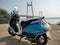 A new branded electric scooter launched recently. Travelling to a scenic location with a beautiful suspension bridge.