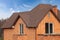 New brick house with modular chimney, Stone Coated Metal Roof Tile, plastic windows and rain gutter.