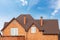 New brick house with modular chimney, Stone Coated Metal Roof Tile, plastic windows and rain gutter.