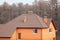 New brick house with modular chimney, Stone Coated Metal Roof Tile, plastic windows and rain gutter.