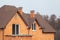 New brick house with modular chimney, Stone Coated Metal Roof Tile, plastic windows and rain gutter.