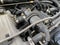 New car alternator, close-up view. An alternator installed in the engine compartment of a modern car. Diagnostics and repair of a