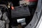 New car battery in car compartment