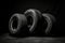 New Car tires pile on dark background. Generative AI