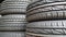 New car tires pile in a row details of tires texture in auto car shop