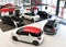 New cars in the sales area of a car dealership - building and ar