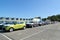 New cars stand on the territory of automobile plant