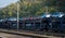 New cars transported with railway platforms. Cars transported by rail. The cars are Dacia Duster of several colors. Many cars