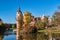 New Castle and pond in the park Muskauer during autumn