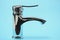 New chrome or steel mixer tap for bathroom sinks