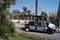 New clean golf course carts cars at luxury resort sport venue in neat line row