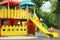 New colorful castle playhouse with slide on children`s playground