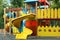 New colorful castle playhouse with slide on children`s playground