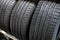 New Compact Vehicles Tires Stack. Winter and Summer Season Tires.Car tires isolated.repair garage. replacement of winter