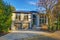 New construction home exterior with elegant stone porch