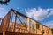 New construction home framing against a blue sky