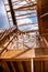 New construction home framing against a blue sky