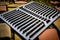 new cooking grate made of metal in backyard grill