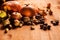 New crop: pumpkins, apples, nuts and dry leaves on wooden background, fall harvest, selected focus.