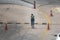 New Delhi, Delhi, India - 05/05/2020: A fearful woman wearing face cloth as mask and glasses walking on deserted streets alone