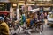 New Delhi, India - April 16, 2016 : Rickshaw rider transports passenger on April 16, 2016 in New Delhi, India. Cycle rickshaws