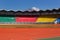 New empty colorful stadium with beautiful mountain in background