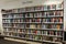The new fiction aisle of a public library showing rows of books