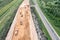 New freeway under construction. heavy construction machinery works on road construction site. aerial view.