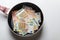 New frying pan with money euro banknotes isolated on a white background